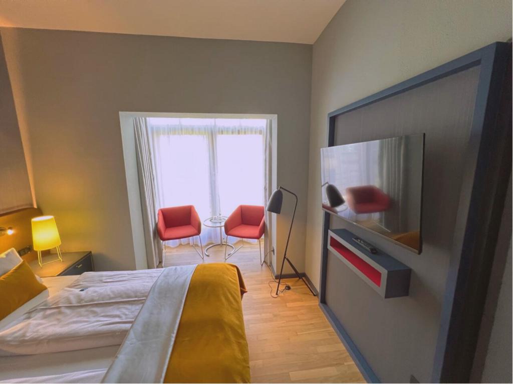 Postel nebo postele na pokoji v ubytování Lint Hotel Köln