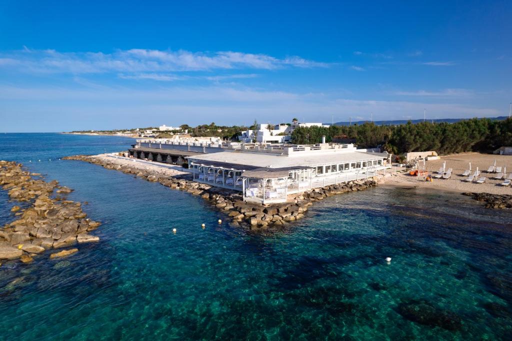 an aerial view of a dock in the water at La Peschiera in Monopoli