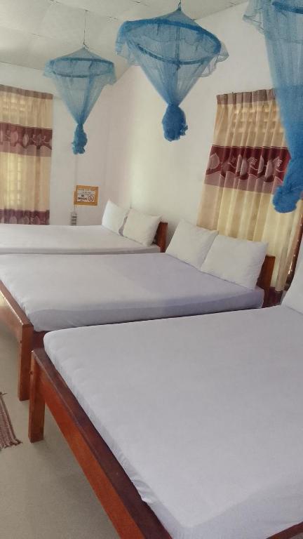 Postel nebo postele na pokoji v ubytování Pranu House