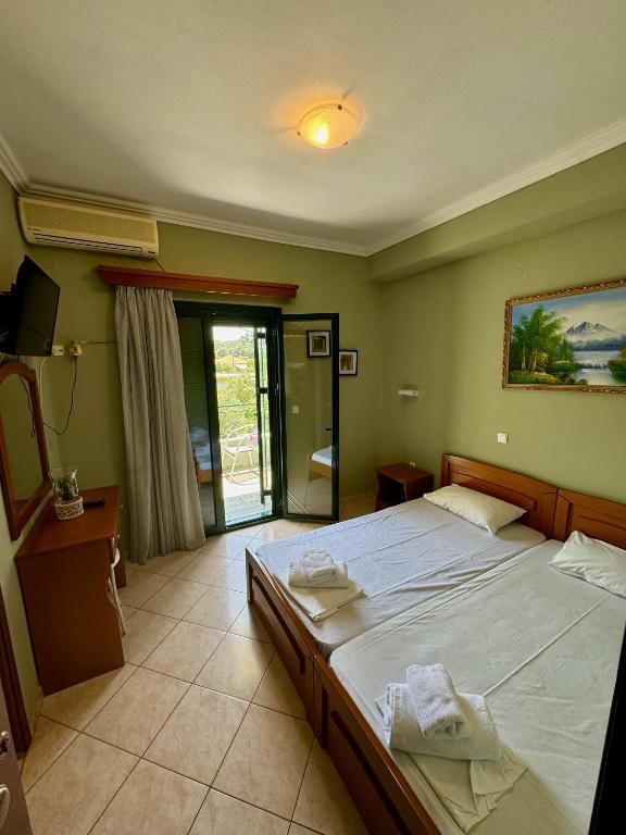 Postel nebo postele na pokoji v ubytování Hotel Filoxenia