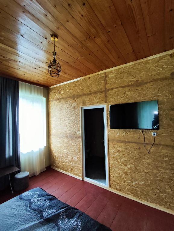 Postel nebo postele na pokoji v ubytování guest house udziro