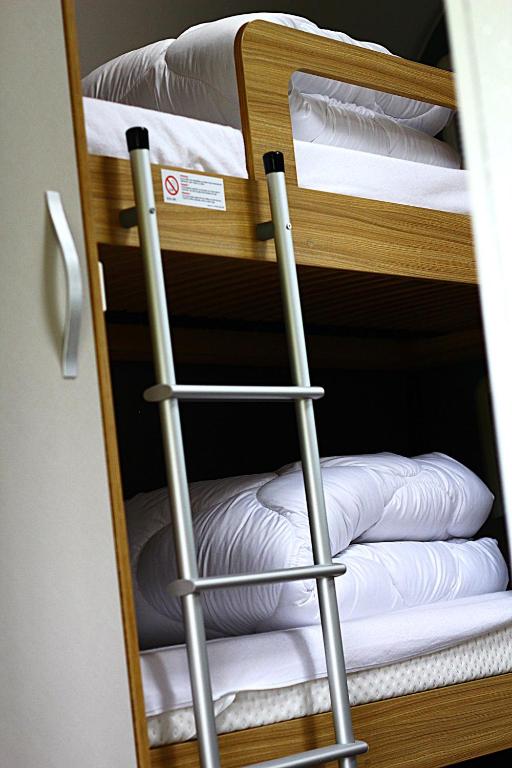 Postel nebo postele na pokoji v ubytování Mietwohnwagen