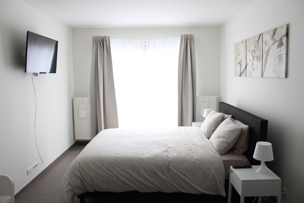 Cama o camas de una habitación en Casa Blanca Ghent