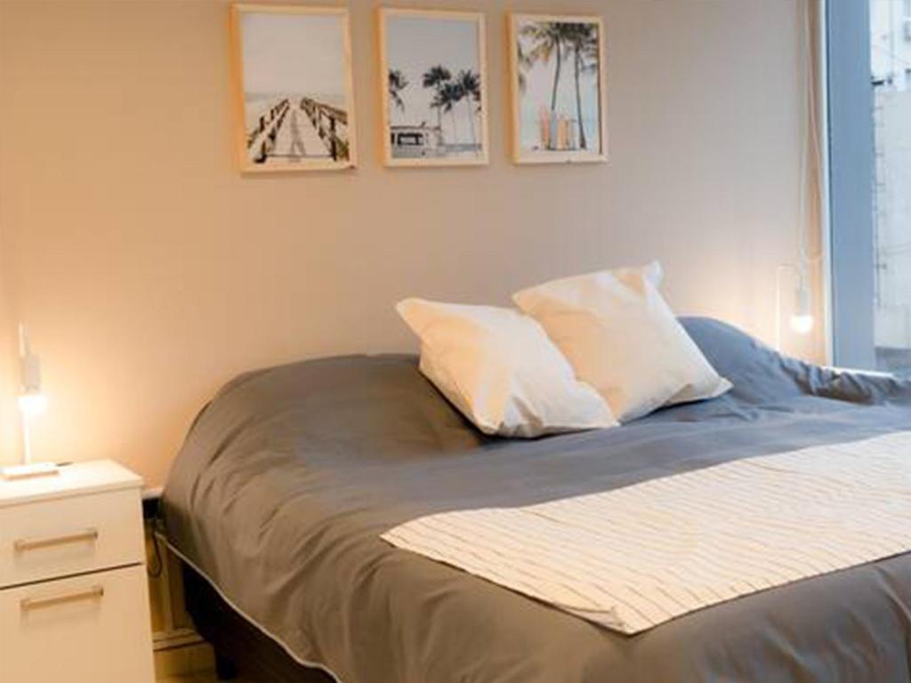 Postel nebo postele na pokoji v ubytování BORGES HOUSE APARTS Apartamentos con cochera a dos cuadras del Obelisco!