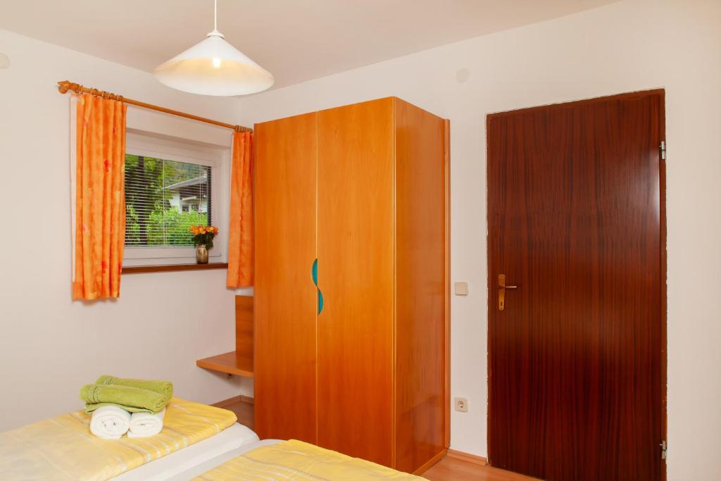 Postel nebo postele na pokoji v ubytování Seeapartments Kärnten