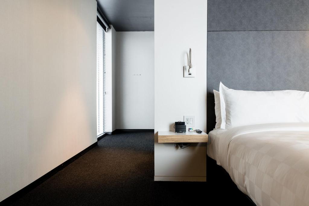 Postel nebo postele na pokoji v ubytování Alt Hotel Winnipeg