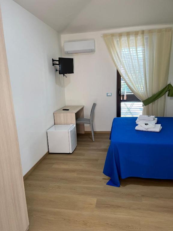 Postel nebo postele na pokoji v ubytování La Terrazza degli Dei