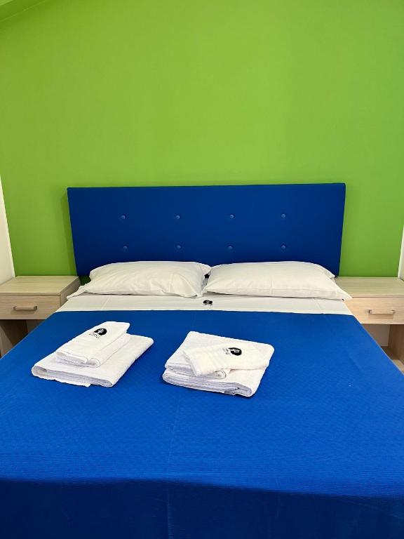 Postel nebo postele na pokoji v ubytování La Terrazza degli Dei