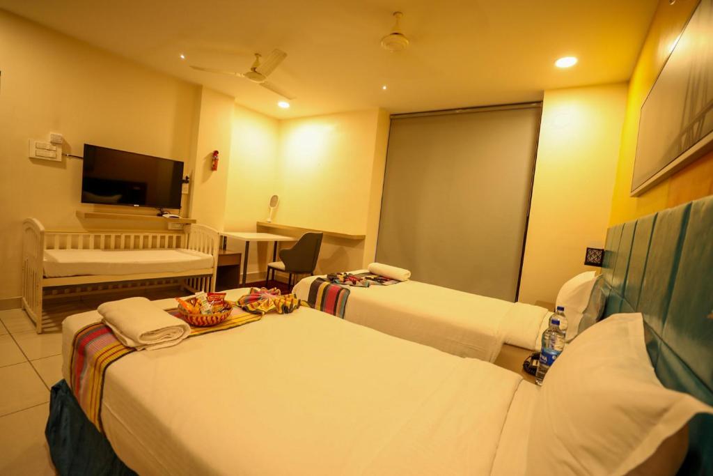 Postel nebo postele na pokoji v ubytování Hotel White Fields Hitec City, Hyderabad