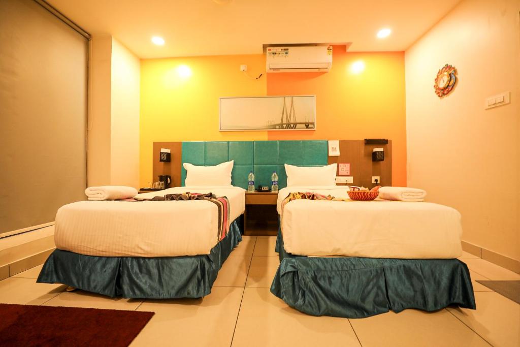 Postel nebo postele na pokoji v ubytování Hotel White Fields Hitec City, Hyderabad