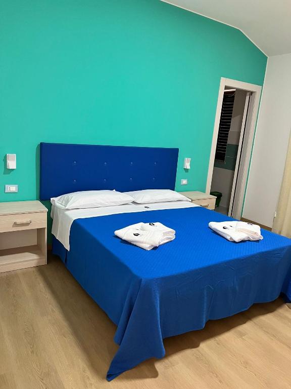 Postel nebo postele na pokoji v ubytování La Terrazza degli Dei