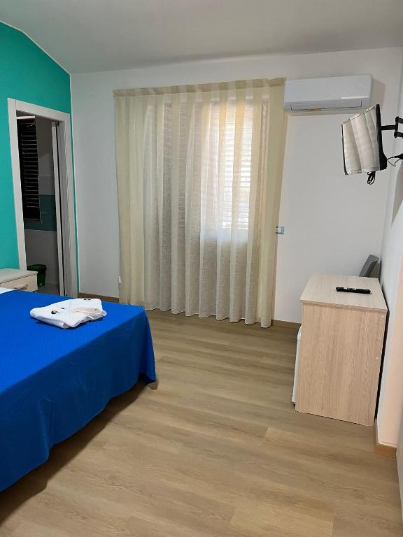 Postel nebo postele na pokoji v ubytování La Terrazza degli Dei
