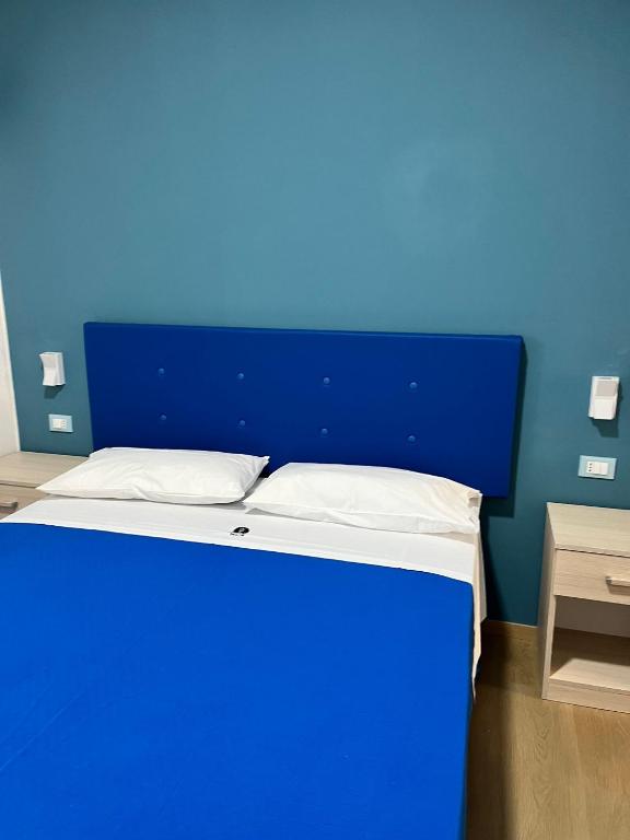 Postel nebo postele na pokoji v ubytování La Terrazza degli Dei