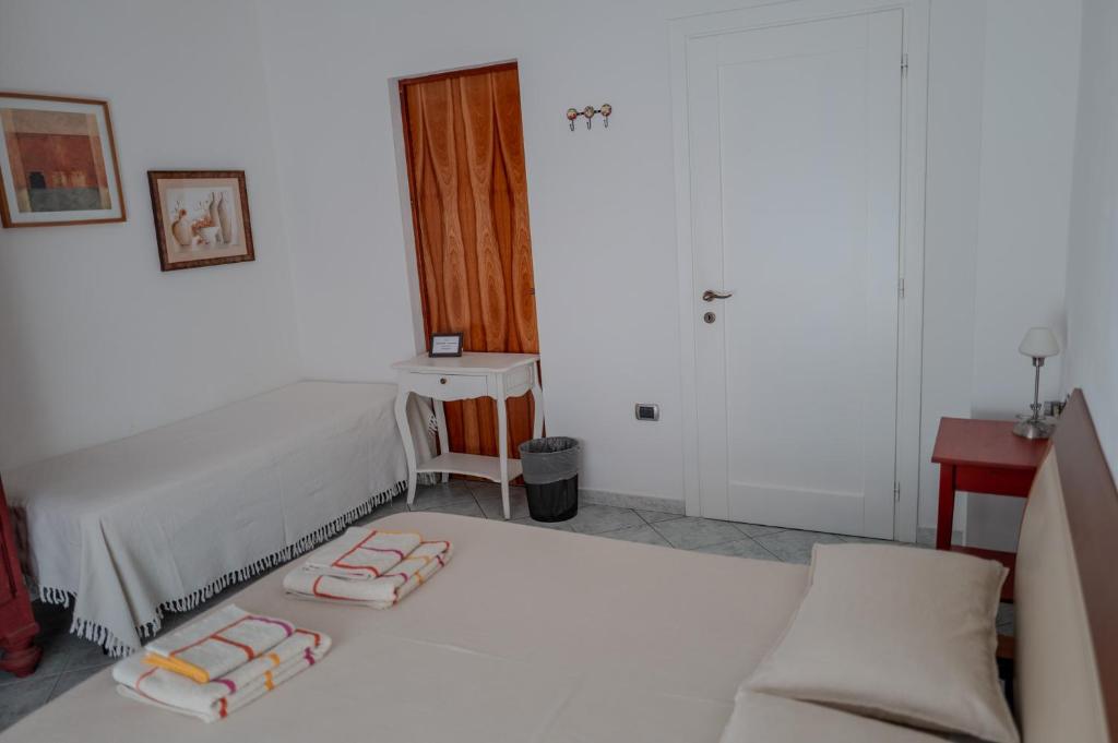 Postel nebo postele na pokoji v ubytování I Ginepri B&B