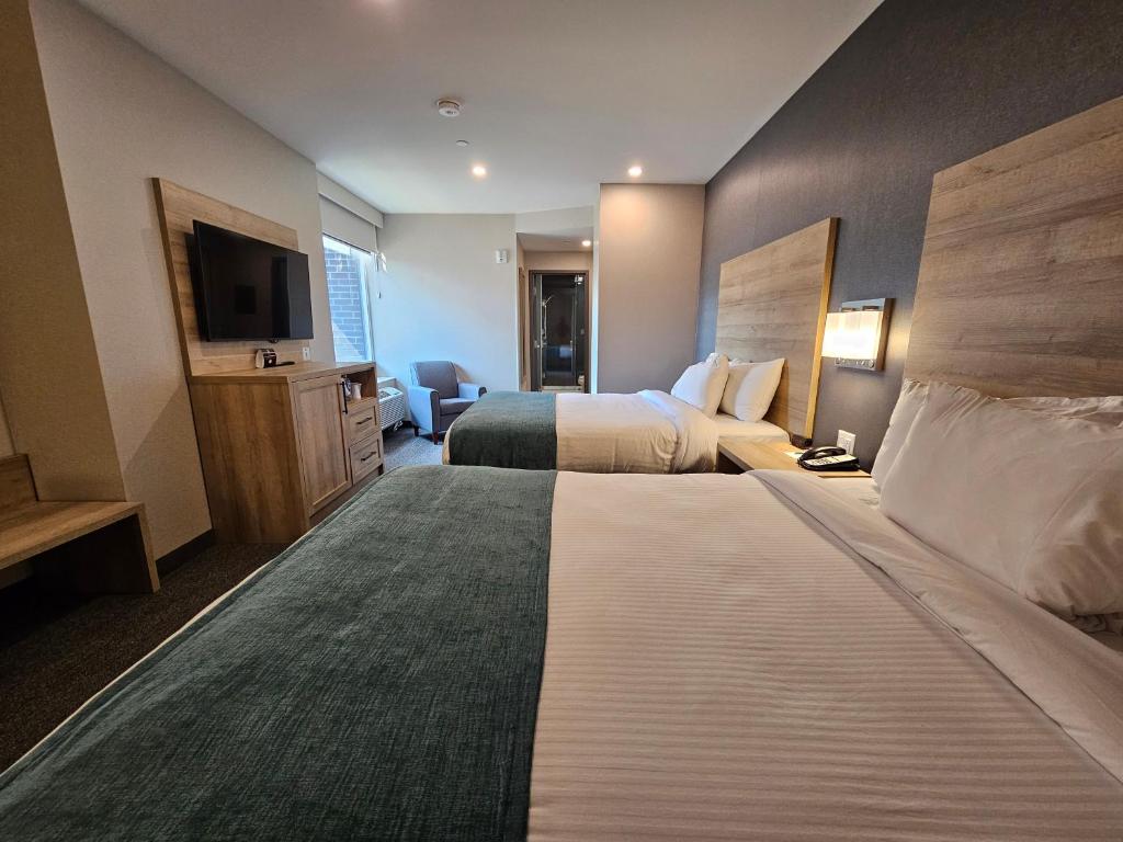 Postel nebo postele na pokoji v ubytování Vittoria Hotel & Suites