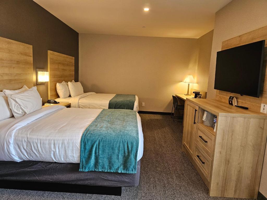 Postel nebo postele na pokoji v ubytování Vittoria Hotel & Suites