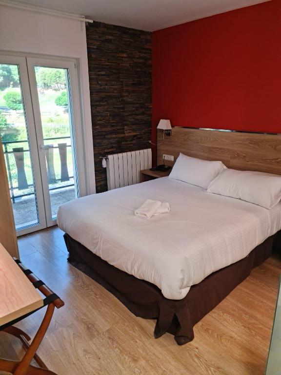 Postel nebo postele na pokoji v ubytování HOTEL VICTORIA