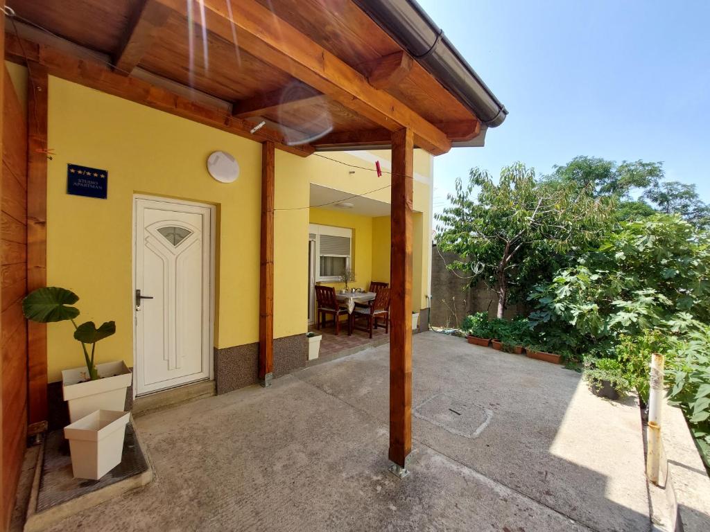 an outside view of a house with a white door at Maja in Kolan