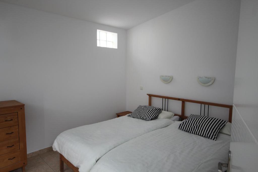 Postel nebo postele na pokoji v ubytování Estupendo bungalow cerca del mar
