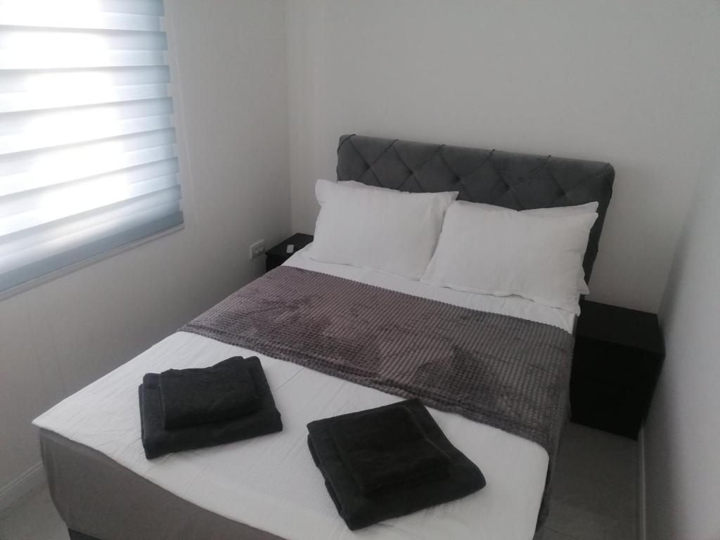 Postel nebo postele na pokoji v ubytování Marash apartman - stan na dan