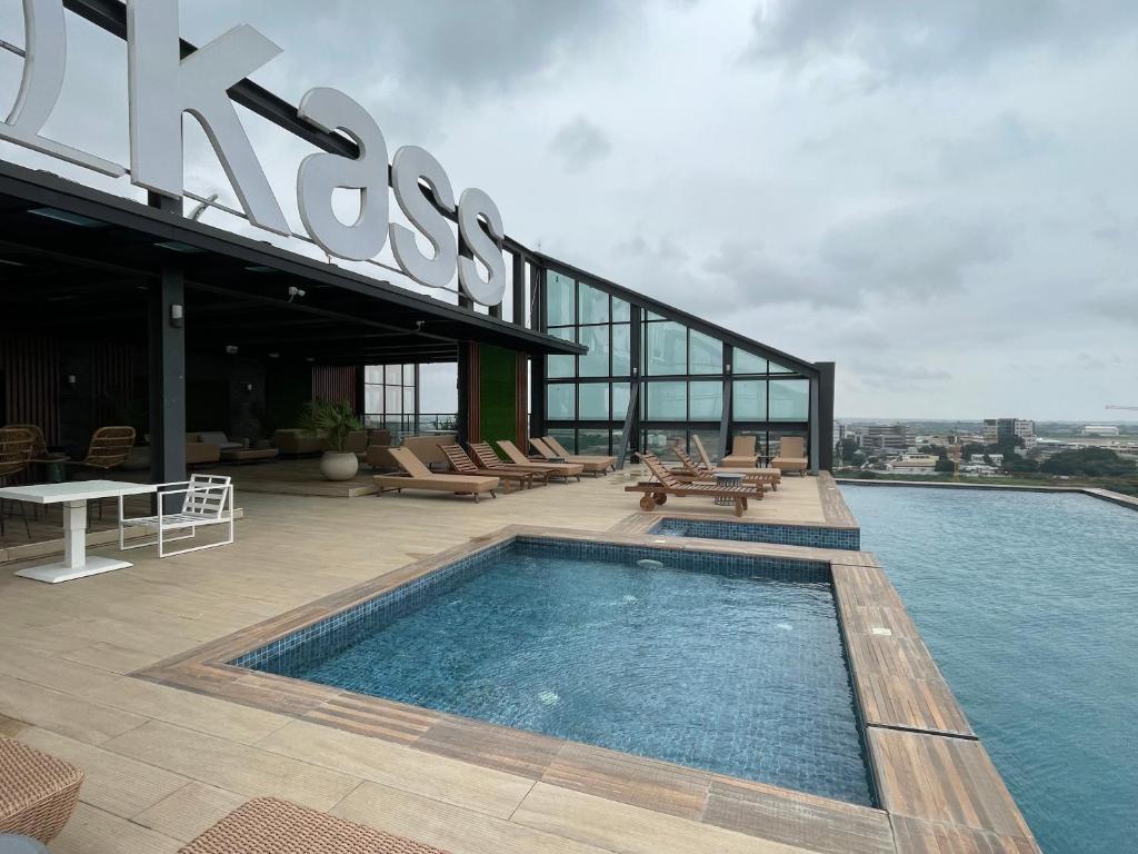 a swimming pool on the roof of a building at Crystal Luxury Studio At Kass 1000 in Accra