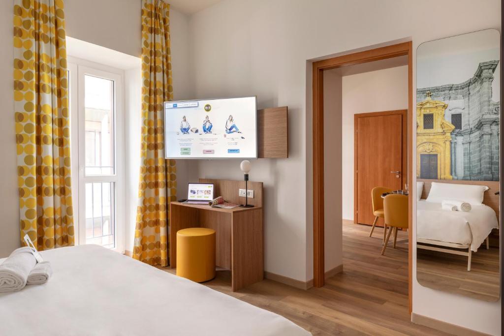 Uma cama ou camas num quarto em B&B Hotel Palermo Quattro Canti