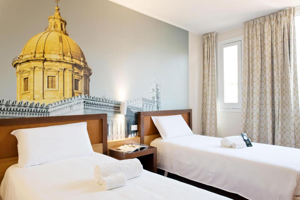 Uma cama ou camas num quarto em B&B Hotel Palermo Quattro Canti