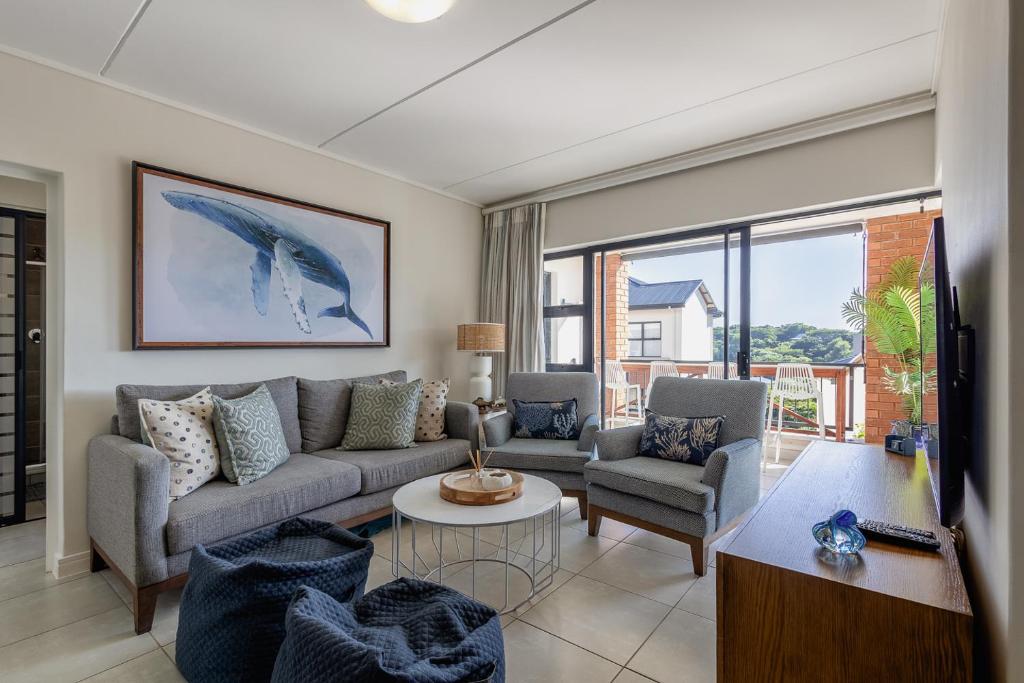 a living room with a couch and a table at 427 Ballito Hills - Lovely 3 bedroom apartment in Ballito
