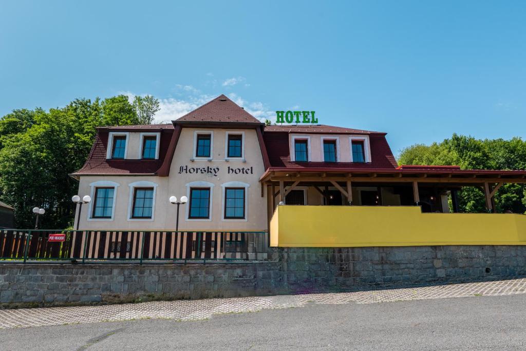 a house with a sign that reads honesty trust at Horský Hotel Kolowrat in Přimda
