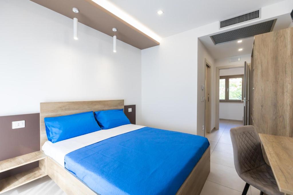 Postel nebo postele na pokoji v ubytování Altum Hotel Tropea
