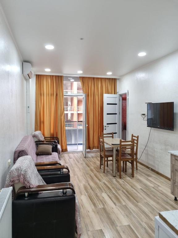 a living room with a couch and a table at Black Sea Line in Gonio