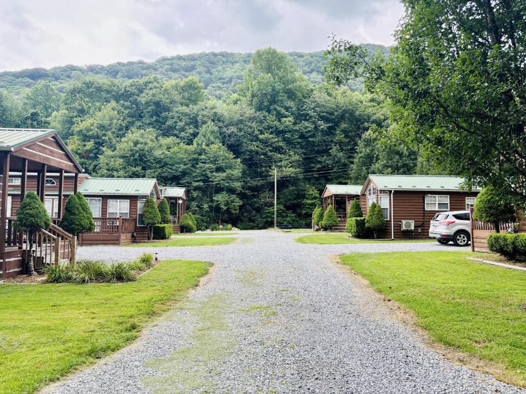 a gravel road through a village with houses at Maggie Valley Cabin Rentals in Maggie Valley