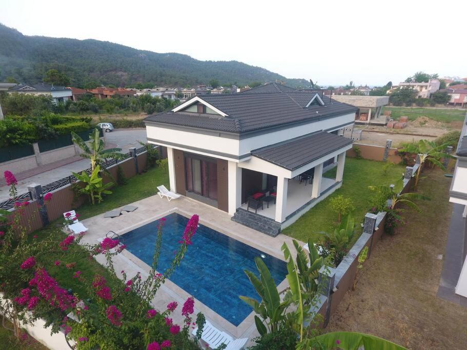 a small house with a swimming pool in the yard at Villa Anı in Antalya