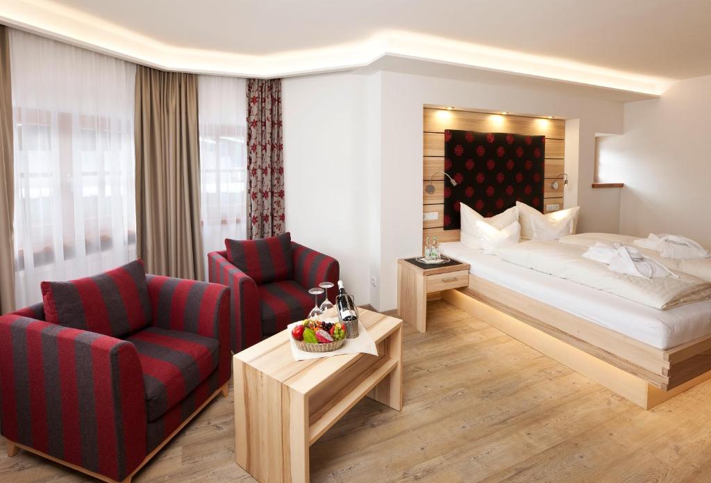 Postel nebo postele na pokoji v ubytování Hotel Filser