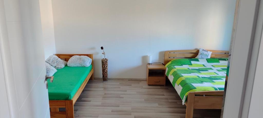 Postel nebo postele na pokoji v ubytování Apartmán Na náměstí
