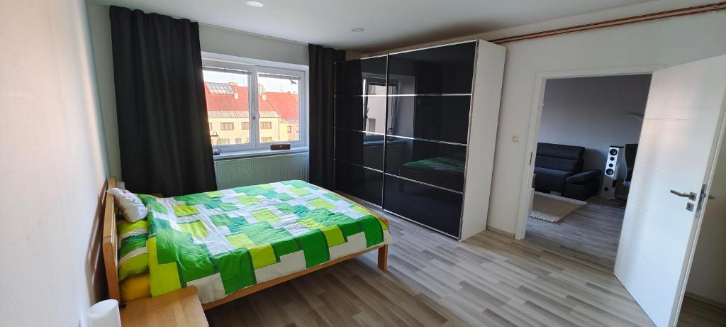 Postel nebo postele na pokoji v ubytování Apartmán Na náměstí