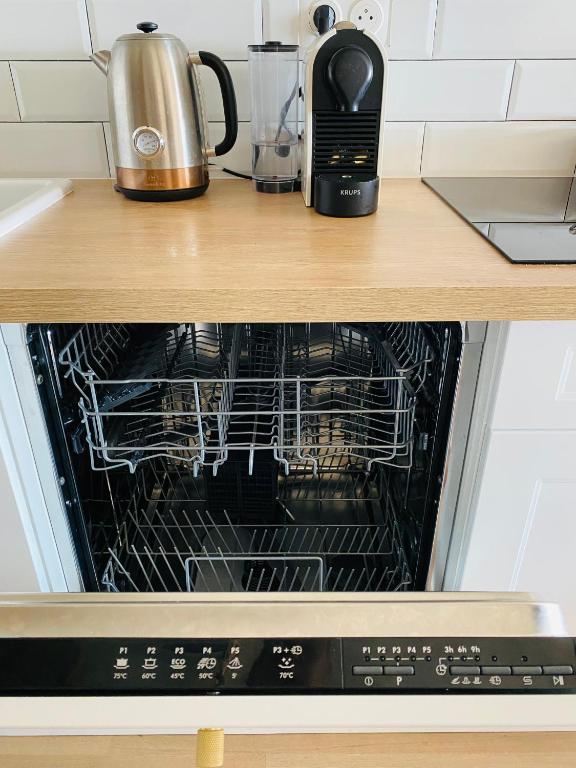 Kuchyň nebo kuchyňský kout v ubytování Appartement cosy