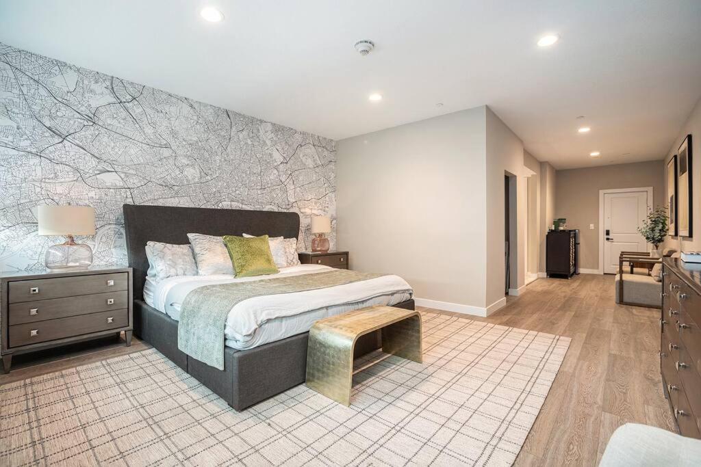 a bedroom with a king sized bed and a stone wall at Private Room with Kitchen & Bath 3 in Bradenton