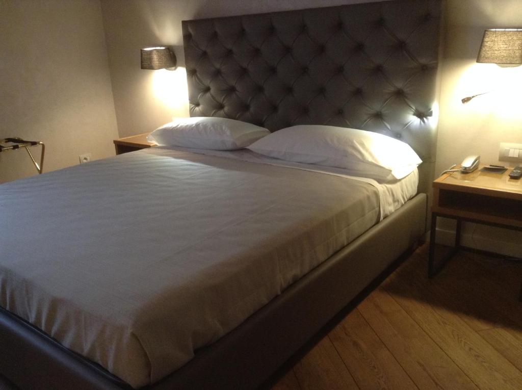 Postel nebo postele na pokoji v ubytování Hotel Elite
