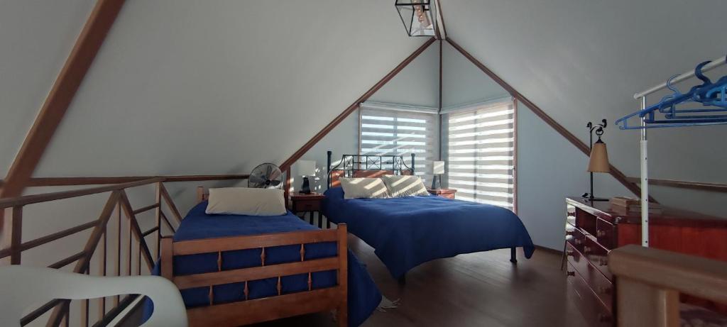 Postel nebo postele na pokoji v ubytování Casa Cumbre Algarrobo