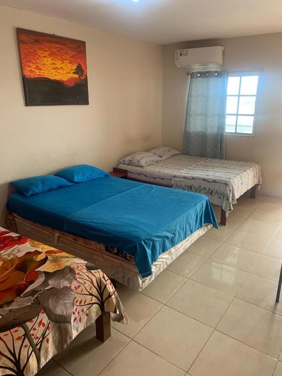 Postel nebo postele na pokoji v ubytování Habitaciones amobladas - Manabí suites