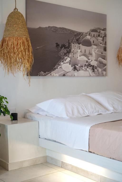 Postel nebo postele na pokoji v ubytování Sandy Villas Perissa