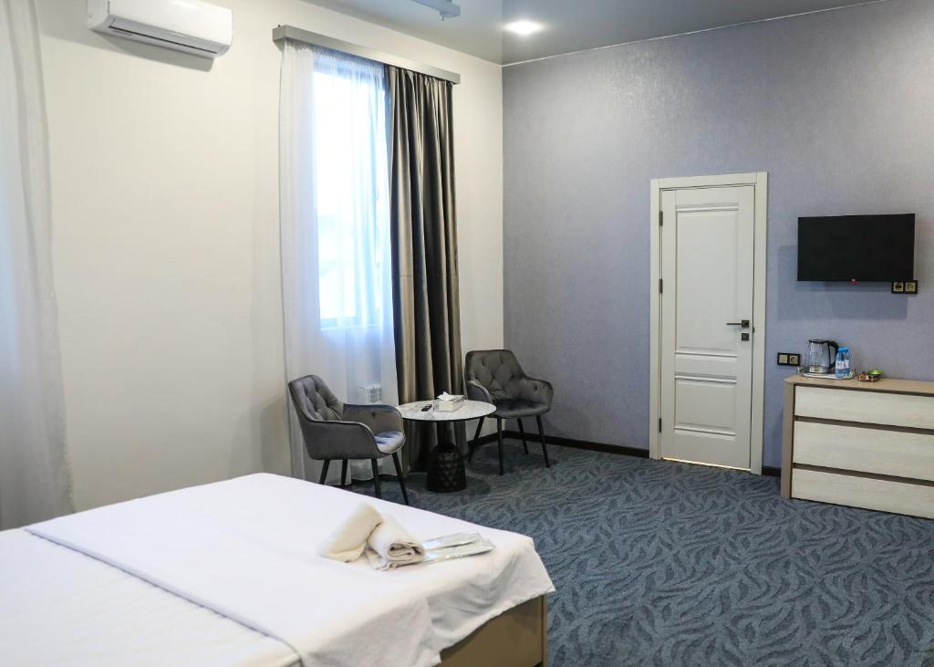 TV a/nebo společenská místnost v ubytování A E K A Hotel