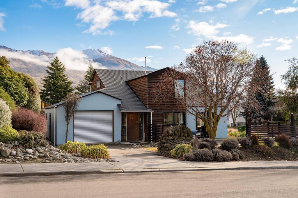 a house with a mountain in the background at Stonehaven in Wanaka