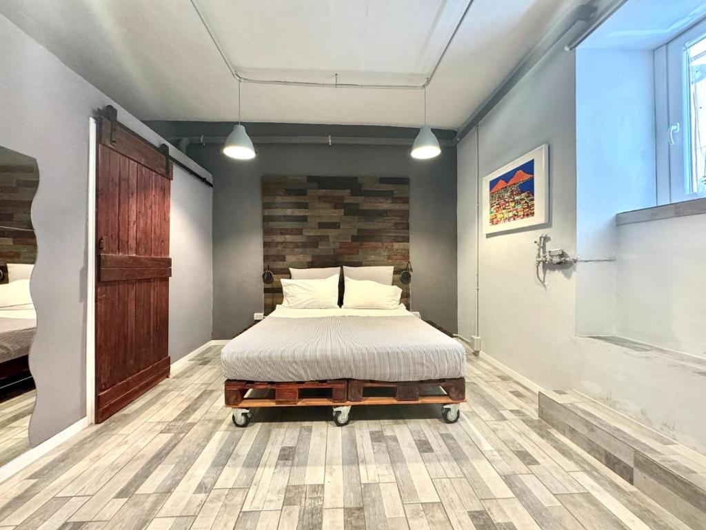 Giường trong phòng chung tại La Cornice - Nel cuore di Napoli