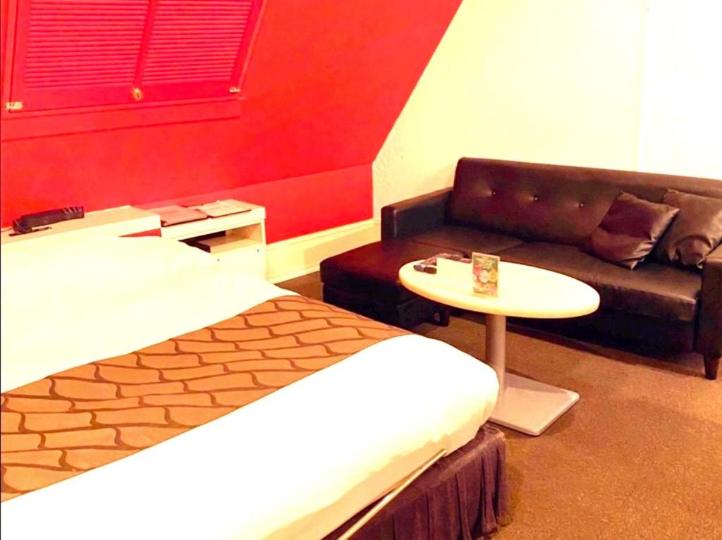 Postel nebo postele na pokoji v ubytování HOTEL WILL渋谷 LOVE HOTEL -Adult only-