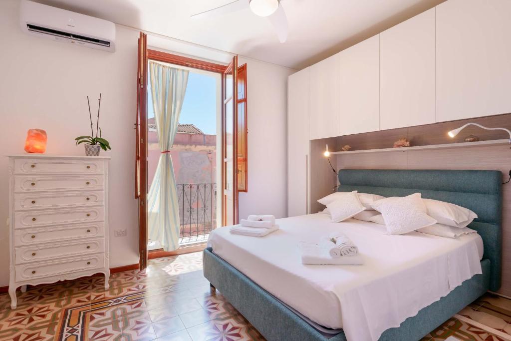 Postel nebo postele na pokoji v ubytování Guest House Baruffi