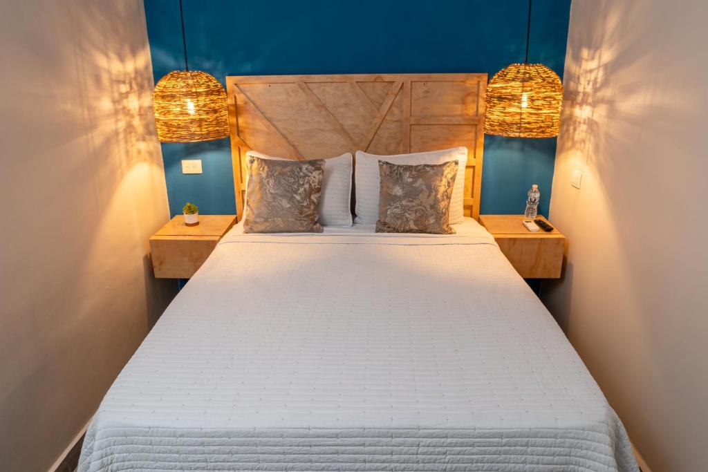 Postel nebo postele na pokoji v ubytování WE Hotel, La Lima