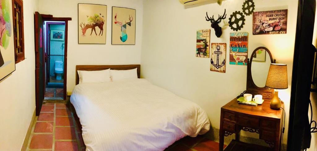 Postel nebo postele na pokoji v ubytování Red Tomato B&B