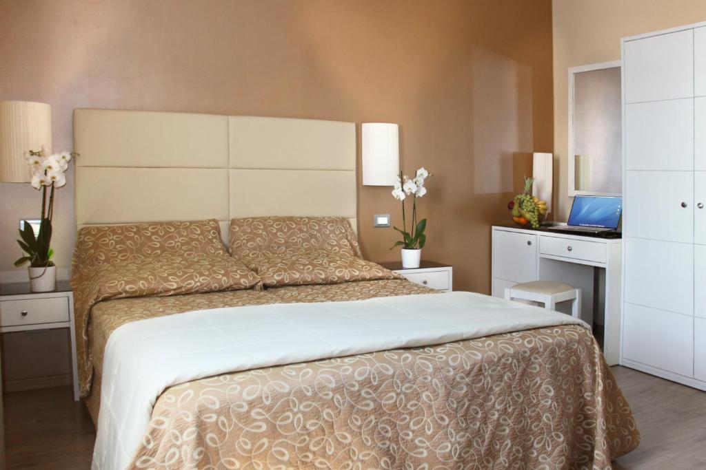 Postel nebo postele na pokoji v ubytování Hotel Regit